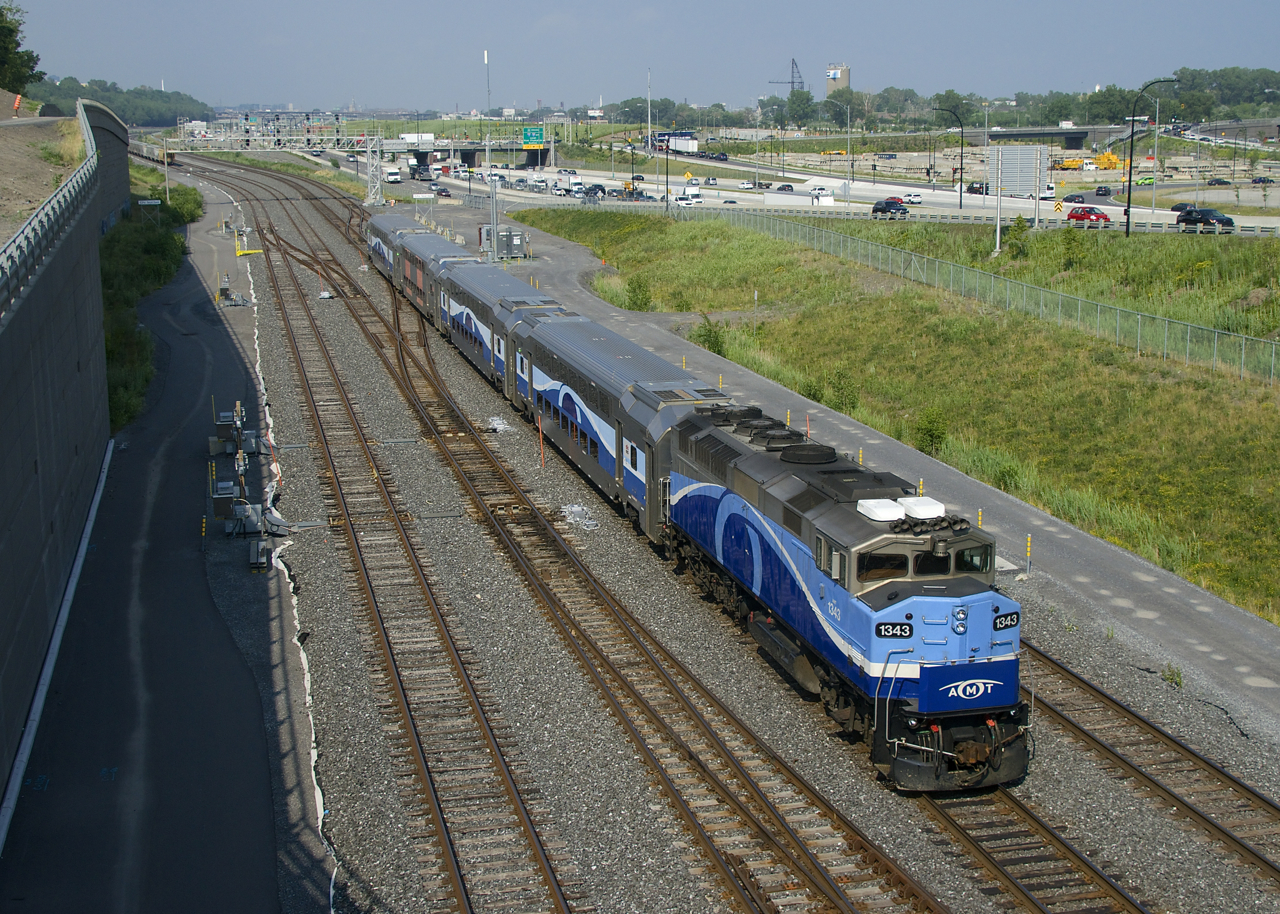 AMT 1343 leads EXO 1207 past Turcot Ouest. In the consist is AMT 3114, one of the few repainted EXO cars.
