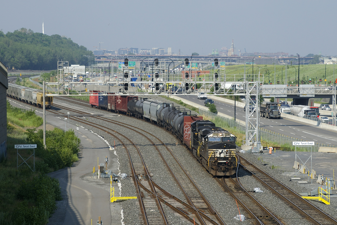 CN 529 has NS 7710, recently rebuilt NS 4490 and only 14 cars as it passes Turcot Ouest. Normally into Montreal very early in the morning, this one arrived later in the afternoon for unknown reasons.