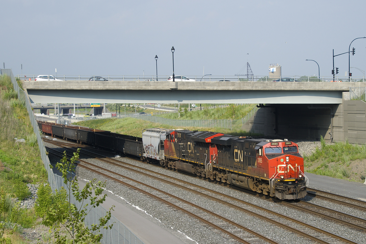 CN 321 has the usual gons behind a single hopper as it heads west with CN 2885 & CN 3120 for power.