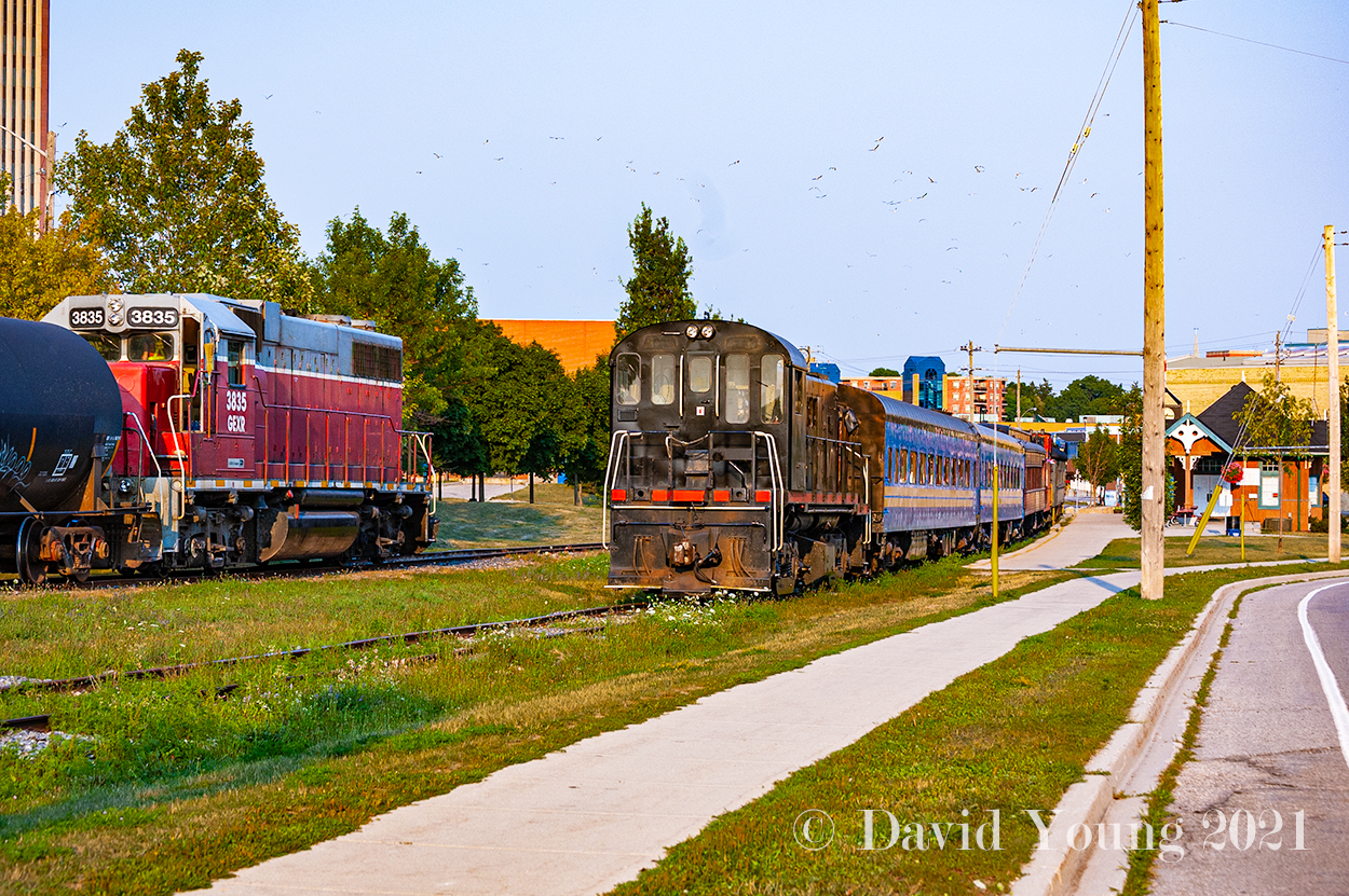 GEXR meets OSR in Waterloo? It happened. Goderich and Exeter local No. 584 is returning from Elmira passing  "Tar Baby" who was leased to the Waterloo Central in the summer of 2007 for their operations. Here she rests in the siding, coupled to WCR's mix of passenger equipment next to the "new" Waterloo station built for the upstart Waterloo-St Jacob's Railway a decade prior. To say this area has undergone a major facelift, would be an understatement. The WCR hasn't been based out of Waterloo in years, relocating their base up the line to St Jacob's after the ION light rail project moved in, forever changing this scene.