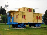 Perusing through the Canadian Trackside Guide a few weeks ago, I was intrigued by an entry indicating that there is an ex. Erie caboose on display in Chatham, ON.  I found it on Google street view, and was initially appalled by the gaudy paint.  Returning from week at a cottage today, we took a break off the 401 to go check out the caboose; mainly to see if it's still there and in hopes it looked a little better.  Nope, still horrendous.  I'd love to know the story of how this Erie Dunmore caboose (and a fire truck) ended up on display next to an End of the Roll carpet store on the north side of Chatham.  I suppose it could have come off the CASO when it was still operated by Conrail, but it was obviously trucked to this location.  The trackside guide lists the car as "No #".  It'd be easy to figure out the car number had the "KarTrak" barcode tag not been painted over.  Shortly after I took this photo the skies opened, so I wasn't able to look around much.  The interior looked mostly gutted, with a card table and chairs inside.  Usually you see cabooses on display that are local to nearby railroads, so this Erie caboose sure isn't what you'd expect to find in Southern Ontario.    