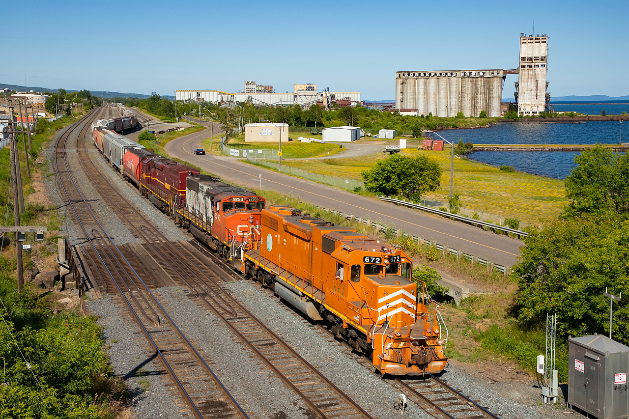The CN 1555 Yard Job is pictured from the Marina Park Overpass with a pull of empties from Richardson (the non-derelict looking terminal in the backdrop). The head end cars were CPs, and the remainder CNs, which needed to both be moved for them to later take some recently arrived cars from a CN G840 unit grain back down to Richardson to spot.