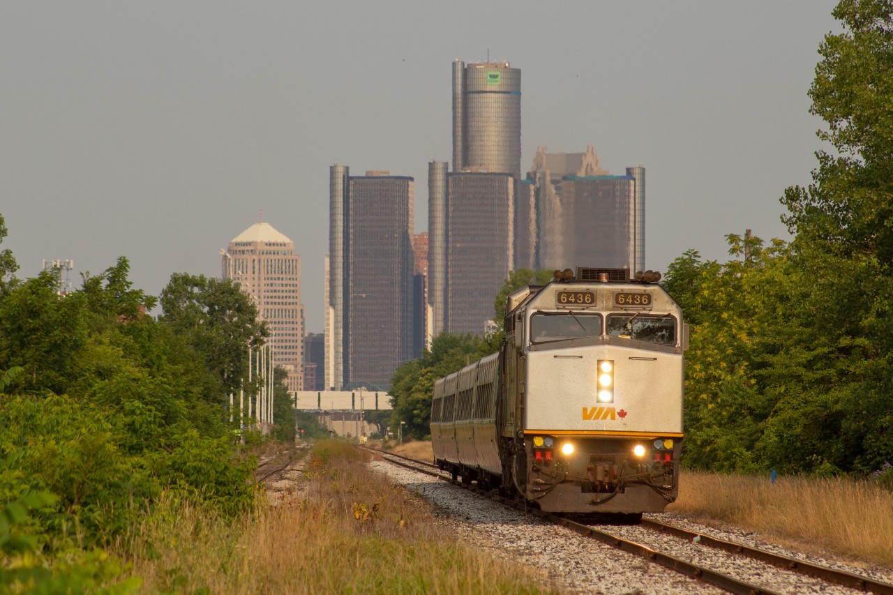 Via 72 Departs Windsor Ontario bound to Toronto Union, on an early and quiet morning, with the GM tower standing tall in the background.