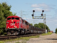 CP 6262 & 6013 lead a short CWR Westbound through Bartlett Avenue where they will drop 1500ft of rail just West of the crossing