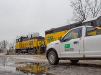 ETR 104 works the Cp electric Yard in Windsor with the Essex Terminal Railway truck standing guard.