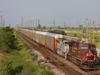 CP train 147 storms past Hornby East with military tribute SD70 7023 trailing. The former Expressway yard can be seen in the background, and is now a transloading facility operated by Cando contracting.