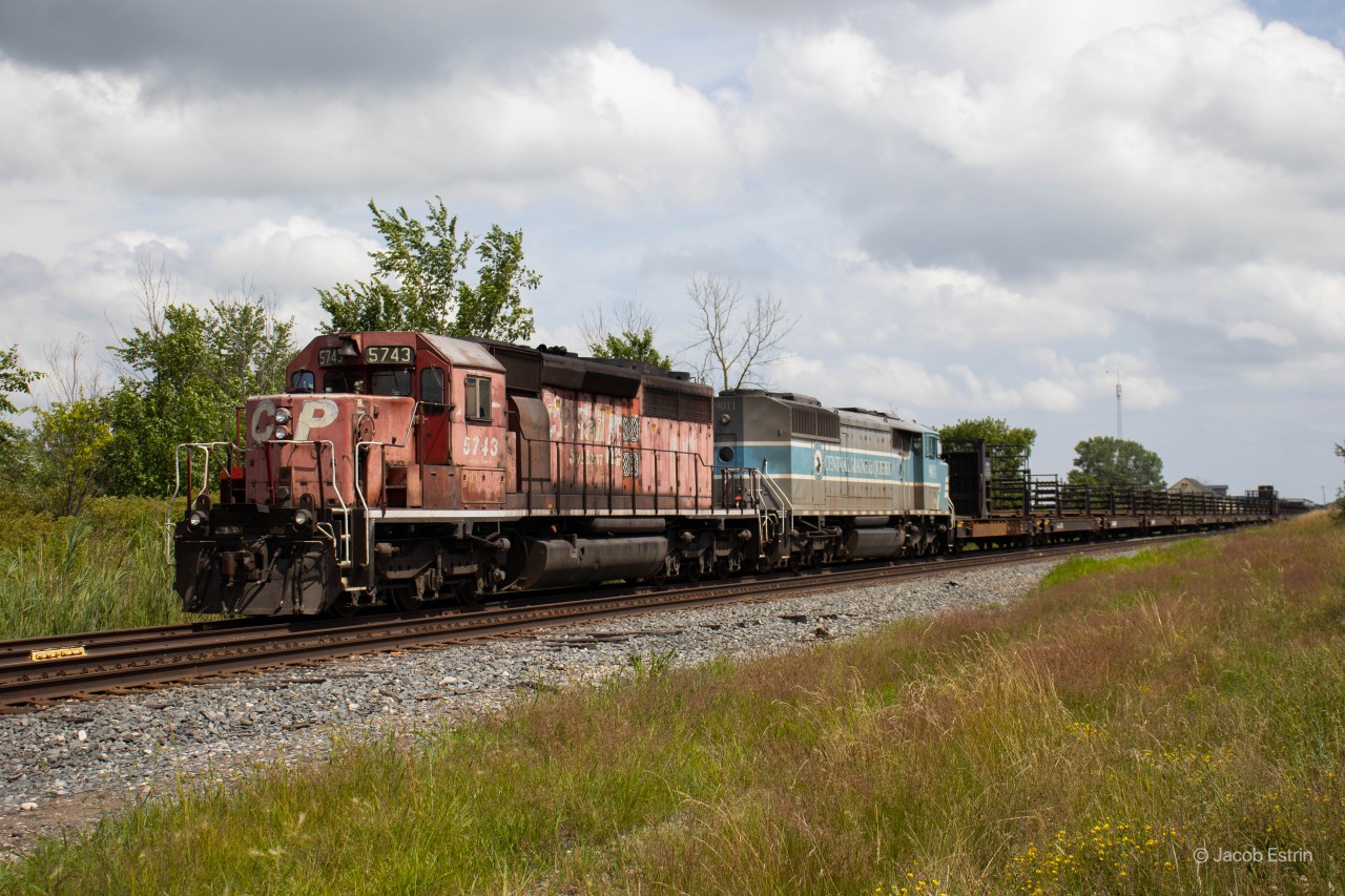 CP 5743 & CMQ 9011 seen sitting in the Smithville Siding just South of the Station Street crossing in Smithville, Ontario.