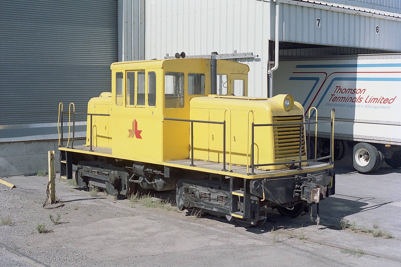 Critter Time !!   I was out on a wander to see what was going on around the peninsula when I happened across this little unit in Port Colborne.  It was sitting at the Maple Leaf Mills plant down by Lake Erie.  This property is now known as Archer Daniels Midland (ADM). The switcher arrived from Conagra in Buffalo in 1995 and upon the takeover by ADM, departed for an affiliated ADM plant in Decateur, Illinois in 2002.  I had wondered about the history of this unit until Michael Klauck informed me the information was available at Raymond Kennedy's Old Time Trains site. Thanks, Mike!! And to Raymond, of course, for such an informative site.