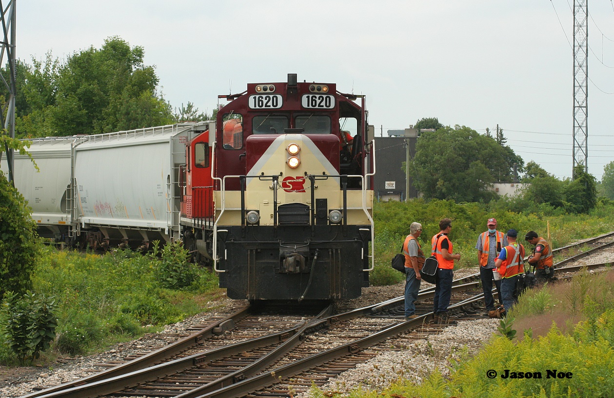 The last Ontario Southland Railway (OSR) Job #1 re-crew is occurring as a group of railfan’s take photos, capturing the official last day of OSR operations on the Guelph Junction Railway (GJR) in Guelph.
