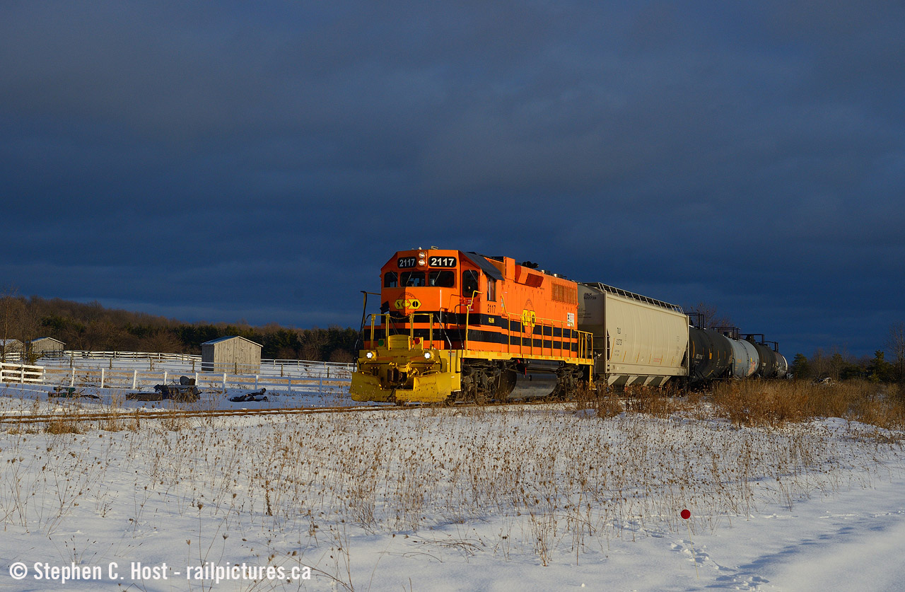 GEXR afternoon job 583 is pictured passing by the horse farm in Corhwin, under amazing lighting conditions that just didn't quit, I had the sun to the rear and dark clouds to the south the entire way. Made for quite an enjoyable chase as every stop turned out just great. RLHH 2117 was transferred to Goderich after the incident there at the end of the month in 2021.