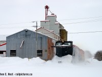 Upon hearing a rumour there might be a plow out, I looked outside and was puzzled - this wasn't plowing weather, so I said 'surely you jest'. Since I don't go to GEXR country too often anymore, and with roads clear and nothing to lose, I decided to head out and see what I could find as I figured I could catch up to it as the train had already been on duty. I found them at Mitchell preparing to depart and with not much time the chase was on. Pictured is a scene at Seaforth that hasn't really changed all that much, in the background is the Seaforth Elevators and Expediting at left, and the old Boilersmith factory at right, still active. Later that day, I'd get a surprise I'd <a href=http://www.railpictures.ca/?attachment_id=10273 target=_blank> been waiting 15 years for</a>, another shot at shooting a plow on the <a href=http://www.railpictures.ca/?attachment_id=44245 target=_blank>Exeter Sub</a>