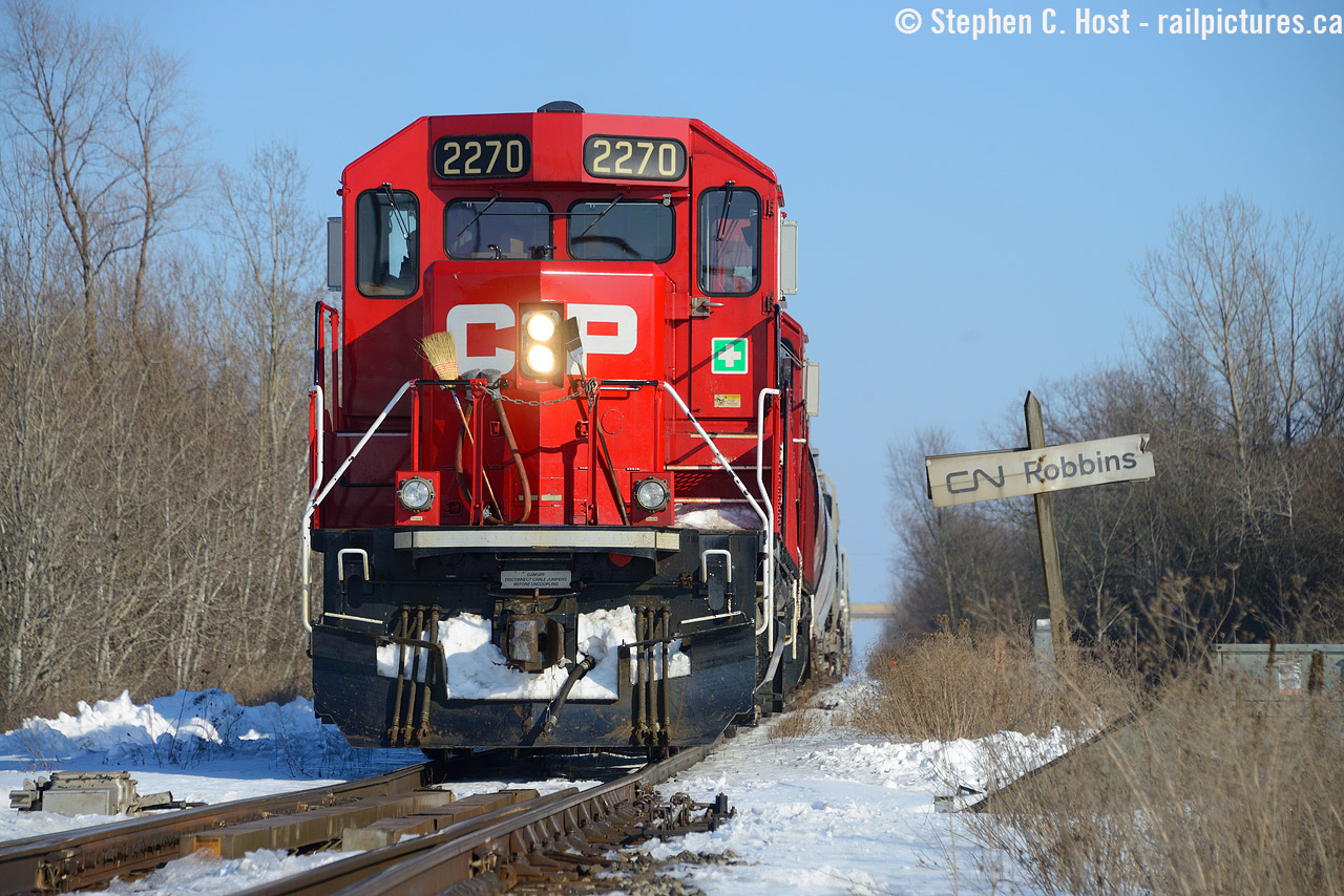 Enemy territory? I'm not going to claim to be an expert in Niagara options, so please do correct me, but I followed a GT Heritage unit (Jordan Station) earlier in the day to Clifton and stuck around the Niagara Region on a cloudless, beautiful , not too cold winter's day. I ended up finding CP TE12? at CN Southern Yard trying to interchange cars in the yard, but they sat there for over an hour and I'd soon find out why - over the radio they couldn't get a switch to close properly and needed a CN MOW crew to come by and help them. After they gave up waiting, they decided not to attempt any further work (rather than try a switch on the south end) and they reversed all the way to CN Robbins to get back on home rails, which is rare because they apparently take the west leg of the wye normally between Robbins West and Brookfield East. While CP does occasionally wye here (they did last night) and of course, mainline CP freights go through here, locals are a rarity. Correct me if I'm wrong, but did CP/CN move the interchange to Southern Yard after NF was abandoned in 2001? Or was Southern Yard enabled for CP after the diamond at Netherby was removed?