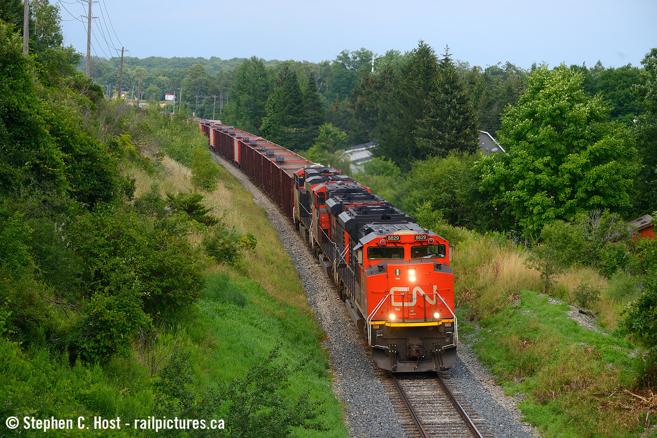 Nearing Guelph after a long slow journey, W933 is dumping ballast on the Guelph subdivision for Metrolinx with a long Herzog ballast train in tow with a few of our RP.CA regulars following along. This was quite the surprise, apparently this train was supposed to run at night, but they decided to run it in daylight.