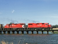 Eastbound grain pickup from Willow Bunch crosses Long Creek as it departs Radville on way to tie up at Weyburn. This was originally a CN line but during the branch line rationalization plan of the early 90's this line was transferred to CP allowing CN to abandon from south of Regina to Weyburn, a section with no customers
