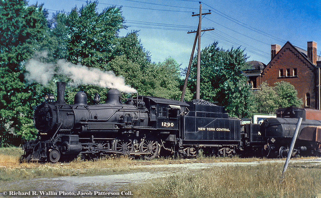 A vintage, home built New York Central F-82 ten-wheeler is seen working the yard in Petrolia.  The 4-6-0, built by the Michigan Central Railroad at the St. Thomas Shops in July 1900 as MCR 449, later MCRR 8152 (1905), NYC 880 (1936) and finally NYC 1290 (1947) had served as a passenger engine for many years until being bumped to way freight service on the St. Clair Branch.  1290 would make its last run on April 27, 1957. The 66.38 mile St. Clair Subdivision was built from Courtright (mile 66.8) on the shore of the St. Clair River to St. Clair Junction (mile 4.23), the connection with the main CASO Division.  Miles measured from St. Thomas.  Originally laid down in 1873 by the Canada Southern Railway and opening in 1874 as a way for the CASO to access the oil deposits of Lambton County, the line connected communities including Alvinston, Oil City, Brigden, and Courtright, plus Petrolia via the Petrolia Spur.  The 12.04 mile Petrolia spur branched north off the St. Clair Sub a couple miles west of Oil City, terminating in Petrolia eventually having a connection to the CNR, whose station (GWR) sits just 2 blocks to the east of this NYC shot.  The 1290 is seen beside St. Paul's United Church (built 1899) at the corner of Petrolia Line and Albany Street.  Albany Street would be built over the NYC right of way after its removal in the early '60s.  After retirement of the ten wheelers in 1956 and 1957, service on the St. Clair Sub was carried out by a number of GP7s unttil abandonment on May 1, 1960.More shots of 1290 courtesy of Canada Southern website which show the auxiliary tender better.1290 on a passenger run.1290 hauling freight.Information per North American Railway Hall of Fame and  the Canada Southern Railway website.Richard R. Wallin Photo, Jacob Patterson Collection Slide.