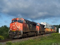 July 31st, 2021 @ 08:14, CN train Z120 passing over the defect detector at MP 42.5, CN Springhill sub (Thomson Stn.) With CN 2916, CN 3815 trailing 446 axles at a reported 57 mph. DPU CN 2901 is mid-train. Dramatic morning sky.