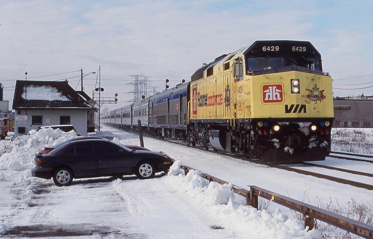 For me a lot of fond memories and friendships were made at Burlington West. It was sad the day the station was moved and the junction was made off limits to railfans. Most Saturday mornings I would try to make it out early enough to catch VIA train 70 somewhere. At the time it was common for it to deadhead extra train sets back to Toronto from Windsor or London. This day was no different as VIA 6429 in "Home Hardware"paint storms past the old station with a good collection of Budd cars.