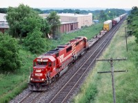 A bit of a dreary overcast day, but not too bad for an eastbound in the afternoon. CP train 421 is seen taking a shortcut over CN to Mimico and the Canpa sub. with a SOO SD60 in the lead, and a 2 unit consist that probably would have not made it up the hill if they remained on the Hamilton sub. up to Guelph junction. 