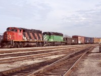 It seemed back in the mid 2000's if you heard a train with a CN GP40 in the lead there was a pretty good chance something decent was trailing it. Back around that time former BN SD40's were common just about anywhere, either sub lettered for BNSF or for numerous leasing companies. No surprise considering Burlington Northern had the largest fleet of SD40's out of all the Class 1's. Here CN train 422 is seen rolling through Hamilton yard with CN 9411 and BNSF 7050.