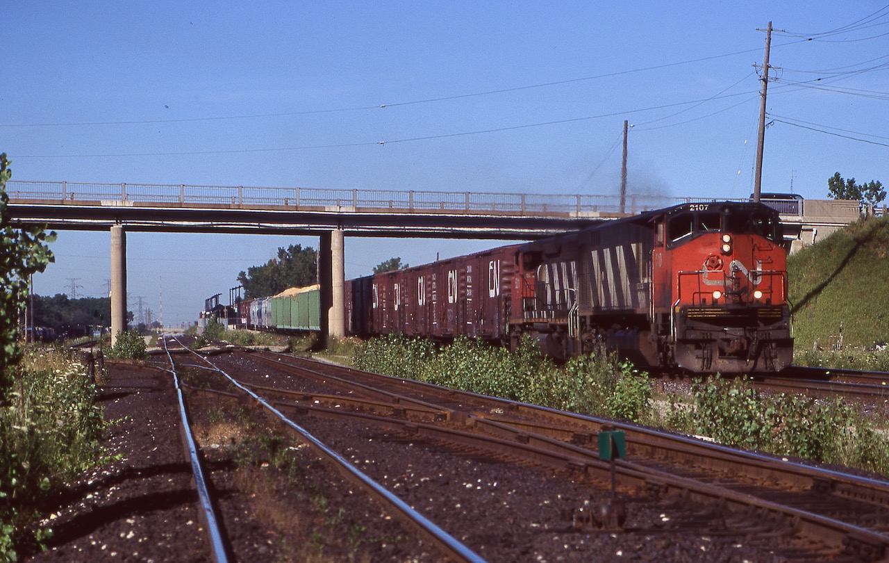 A locomotive model I wish I had more time to document. Bombardier's HR-616 never lived up to its builders expectation, but was certainly an impressive sight out on the rails. In the early 1980's CN purchased a number of examples of the model, which was basically an upgraded M-636. Unfortunately very problematic, the units spent as much time out of service as in service. They were captive to Eastern Canada and by this date were not far from retirement along with the rest of the surviving MLW and BB units on CN's roster. Here HR-616 2107 leads Niagara bound train 449 through Aldershot on a nice summer's day.