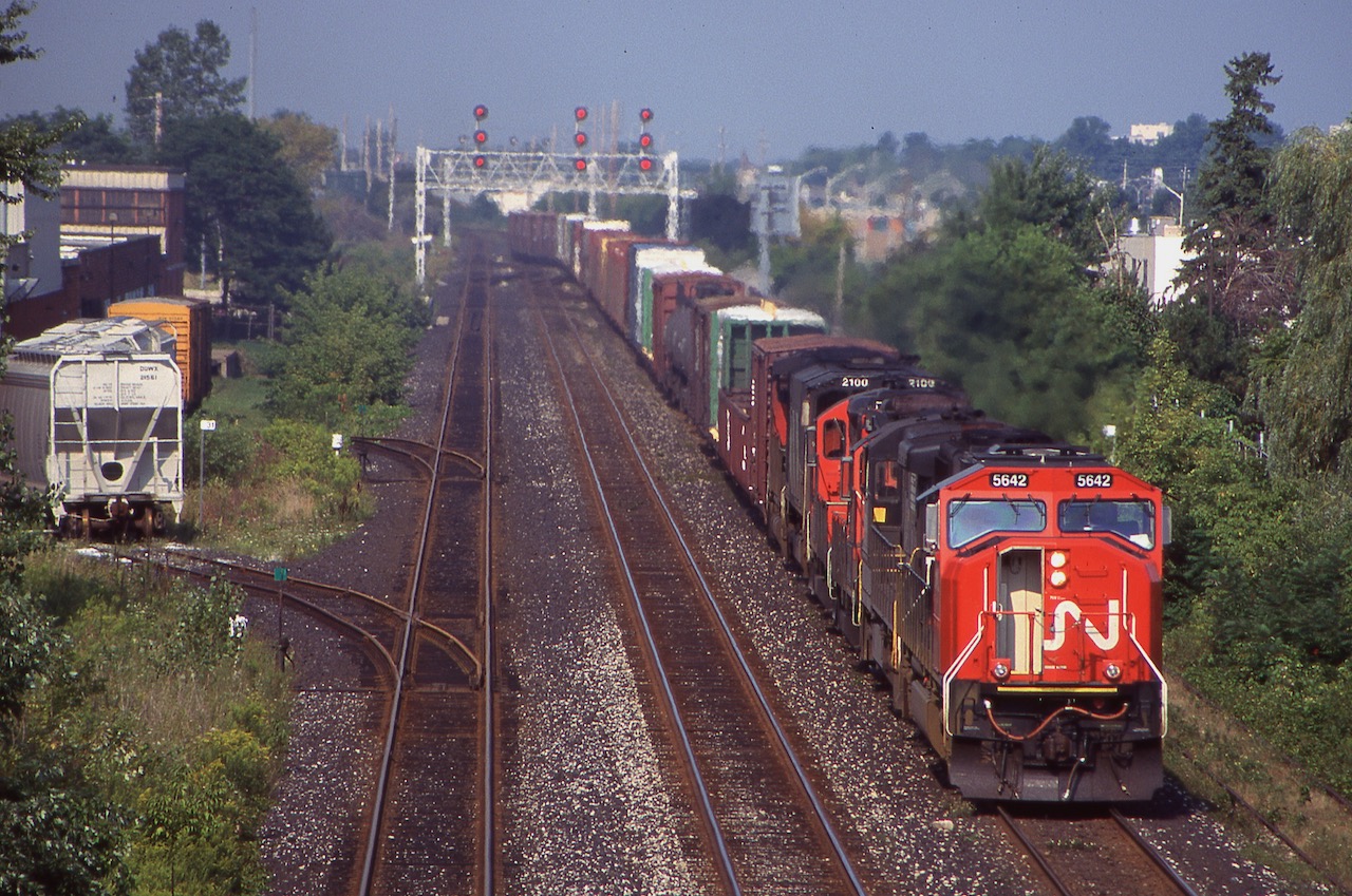 The Oakville sub. east of Burlington east hasn't been heavy with through freights in years but at least years ago it had a few trains polishing the rails. Aldershot yard must have been busy this day as CN 435 left its train east of Burlington West, taking only the cars to be dropped with it then returning as light power. Back then motive power was a decent mix with EMD/GE MLW and BBD power. In the consist this day was a borrowed NS C30-7 and a soon to be retired HR616 along with a few other not as interesting units. Unfortunately the rail served customers to the left are no longer there today and freight wise the Oakville subdivision here is much quieter under Metrolinx ownership today.