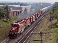 In my notes I have this train written as 525, hope that makes sense as in later years I never came across that number again. This day I was surprised with this much power the train was running over the Oakville sub. and not up the Hamilton sub. to Guelph junction, unless some of these racks were for the Ford plant in Oakville. By this date the old brick works in the background was history and the land was slowly being redeveloped into a residential community. That was not the only change coming to the area, but it would be several years before the Oakville sub. got a full upgrade and the last CP trains ran over the line.
