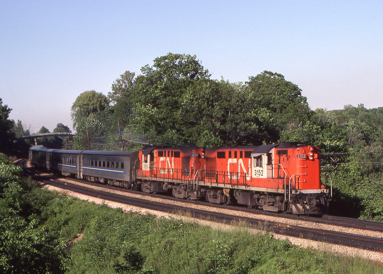 CN 3152 and CN 3155 and their VIA Tempo train are westbound nearing Bayview Junction, Ontario on June 17, 1980.