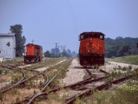 By mid 1999 the Cayuga subdivision had already seen a few years pass since any trough traffic traveled across the line. Trillium operations here were just over a year old and the tracks were gone east of Delhi. The yard sure looked empty this day and most of the rails on the south side were gone. The signals in the distance once protected the CP diamond removed about a decade earlier when CP's line south of here was abandoned. The tobacco shed to the left will be replaced in the not too distant future by a new translating facility. M420 3568 would spend a number of years traveling the line, but sister 3575 would find itself relocated to British Columbia to join a group of other M420's with the shared Trillium/Night Hawk controlled Kelowna Pacific RR. Trillium would eventually split up wth the KPR venture as well as end its ties with the NYLE and both M420's would end up eventually States side. Today what is left of the Cayuga subdivision sits weed choked and unused after OSR ended its operations here when it took over for Trillium in 2016, and the rails may never see the passage of a train again.