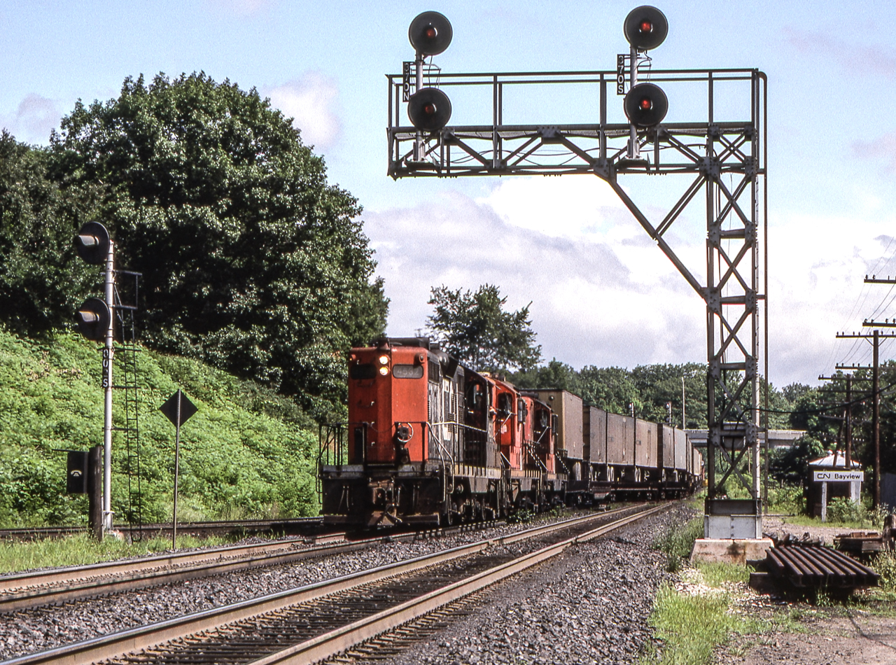CN 4532 is leading her train through Bayview Junction in Bayview Junction, Ontario.