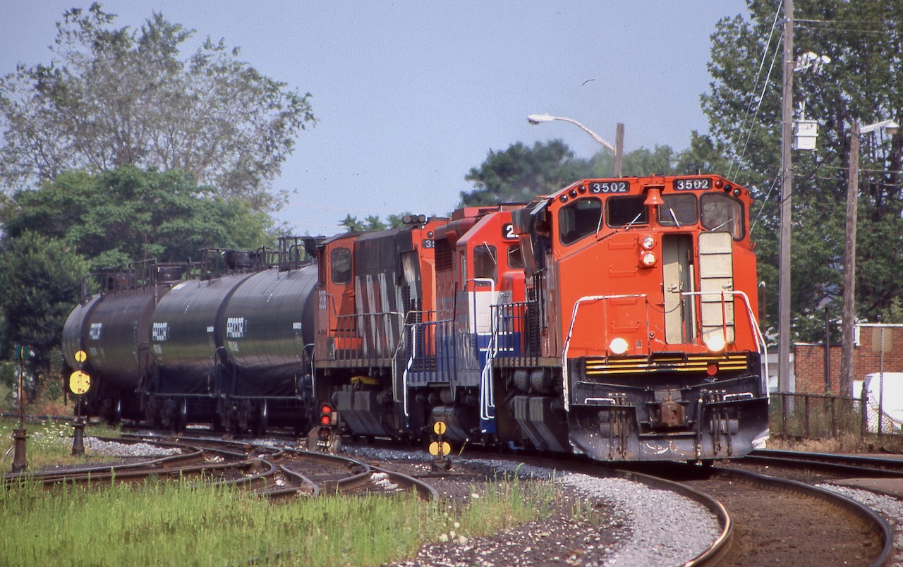 The Railink days were certainly the more interesting days. Railinks roster had a great mix on EMD's, MLW's and BBD's. The railroad owned four M420's and a pair of BBD HR412's, the M's spent most of their time assigned to Hamilton and Brantford while the BBD's mainly stayed up in North Bay. This day the train out of Garnet made a rare daylight move to deliver a short train of tank cars to CN, with M420 3502 and 3508 bracketing one of the railroads GP35's. The lead unit has its Canadian style air conditioning on full, LOL. Sadly RailAmerica's takeover of Railink would bring and end for the MLW/BBD units, with the M's going to the Hudson Bay Railroad, and eventually scrap.