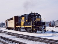 I always liked the former SP GP9 rebuilds that Railink picked up. This was a late production GP9 as it had the side mounted air tanks rather then the ones placed behind the fuel tank. I'm not totally sure of its previous road number but it should have been a 4200 before being renumbered into 1703. One of Railink's SW1200's can be seen in the yard behind, as 1703 is seen switching out Brantford yard on a cold February day.