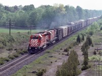 <br>
<br>
   On a steamy June afternoon, CP Rail #916, powered by SD40-2 #5973 and M636 #4709,  head end is clear of Spicer 
<br>
<br>
   At mile 131 Belleville Subdivision, June 11, 1983 Kodachrome by S.Danko
<br>
<br>
   other end: 
<br>
<br>
     <a href="http://www.railpictures.ca/?attachment_id=  45998">  end – of – train device  </a>
<br>
<br>
