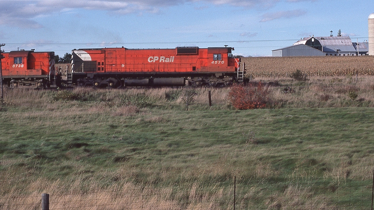 The beauty of those MLW M630's under load: the unique chugging sound of that 251 ALCO designed engine....


   Through the Northumberland Hills, CP Rail 4570 East captured on Kodachrome October 8, 1979