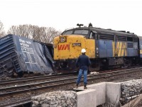 <br>
<br>
   Foreman to Engineman #6764 East:  ' ... oh, just push it out of the way … those FPA-4's are tough ...'
<br>
<br>
   ... so it appears....
<br>
<br>
   At CN Beachville, February 18, 1984 Kodachrome by S.Danko
<br>
<br>
   Noteworthy: 
<br>
<br>
February 14, 1984: A 25 car CN train derailed four miles west of Woodstock ( Beachville) causing $1 million damage. Half mile track torn up, propane tankers included in consist. Heavy rains blamed for weakening the track bed. Reportedly every spring new remnants of the derailment can be seen along the Beachville Thames River Trail – pushed up by the winter frost.
<br>
<br>


