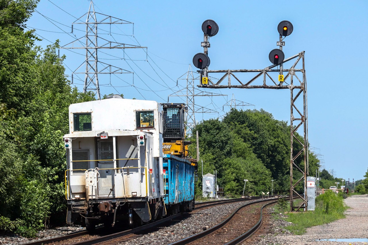 A MOW "Brandt" truck makes its way eastbound on the North Toronto sub as it passes under the famous Bartlett searchlights. Far more interesting is on the tail end: CP 420983. This is a CP owned caboose painted in white and it has been used on various jobs all around the GTA this summer. This train was heading to CP Agincourt yard after dropping a set of gondolas at Lambton.