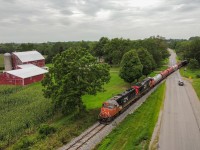 CN L502 breaks the silence at Old Onondaga Road as CN 5730 heads for Garnet after a recrew at Brantford.  The drone came in handy on this overcast afternoon making a shot possible that doesn't stand much of a chance of having perfect light on it unless the train is EARLY.  This was the 3rd out of 4 movements that we shot on the Hagersville on this day.  We chased L580 to Hagersville, then L501 from Garnet to Brantford, followed by L502 Brantford to Onondaga before getting L580 returning North to Brantford.