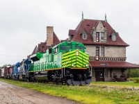 On it's maiden voyage, NBSR 6401 pulls train 907 by the famous railway station in McAdam, New Brunswick. 