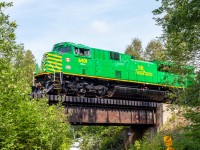 NBSR 6401 powers train 907 as they head over a small trestle approaching Westfield Beach, New Brunswick. 