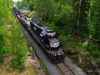 1741 The Black Stallion with 1740 The Ghost for backup leads 213 North through the rock-cut at the Highway 112 overpass destined for Cochrane.

ONT 1741 ex. NS 3535 one of ONR's most recent acquisitions, after some rebuild work at the ONR North Bay Diesel shops, has spent the last week on its first revenue service runs.

Otto Township Ramore Sub - August 30

