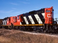 584 heading out at 11:15, passing a farm crossing near mile 37. Cab 79425 on the tailend today, which is unusual as they typically use assigned Cab 79836. 