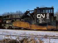 Mild February weather has brought out the work train to continue with track re-hab. In the usual position next to the caboose is Jordan Spreader 50971. Could not resist a roster shot with the sun shining in clear sky. Photo taken at Kerensky, the siding is in the foreground, 9:00 in the morning.