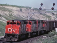 A westbound CN freight with an oh so common trio of "9400s" screams uphill on its way to Toronto Yard on June 3rd 1974.  Forty seven years later, I now realize I should have also taken a picture of the second car.  