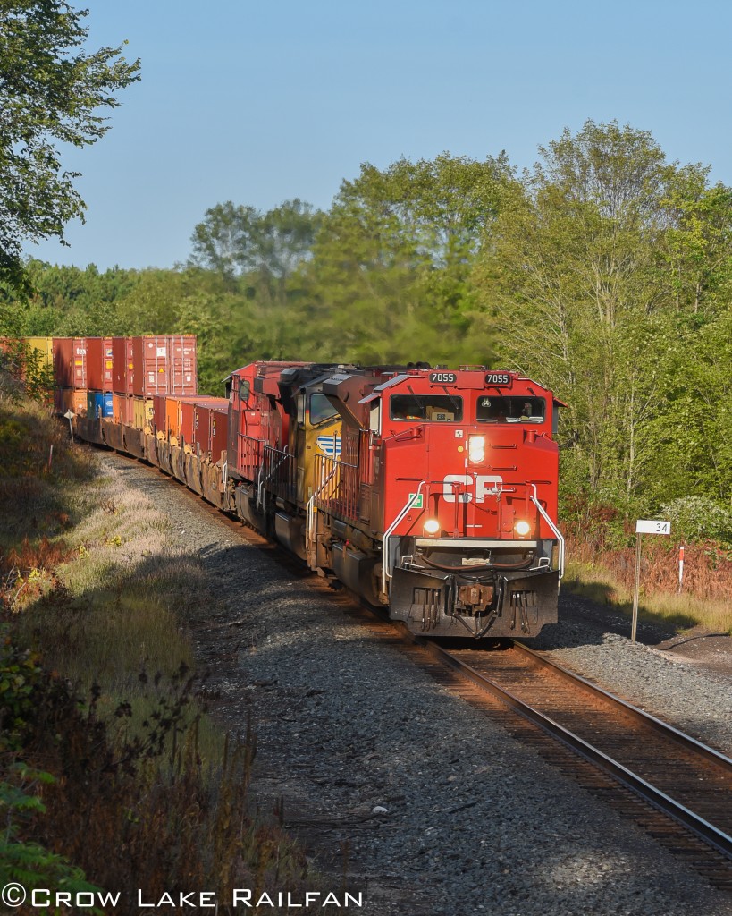 An oddball, a CP 143/ 651 combo takes the curve at Crow Lake. 
It's nice to see one of CP's newer units, a SD70ACu, take the lead of high priority trains once again.