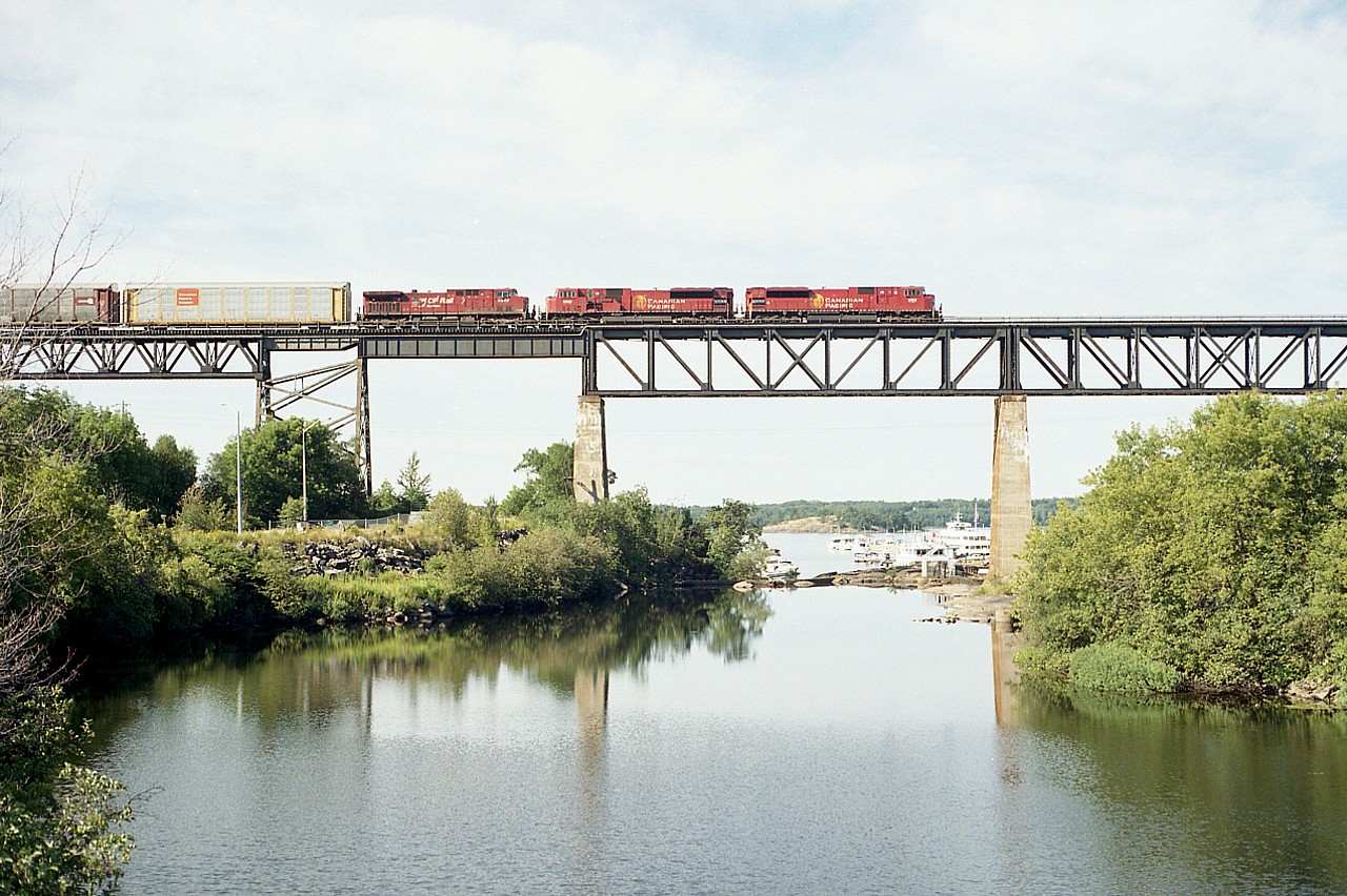 Scenic early morning view taken from the diminutive old CN bridge that used to support local traffic some years ago (now a rail trail). CP 9114, 9100 and 9546 are seen northbound (TT west) over the landmark trestle which spans the Parry Sound harbour area. I've always enjoyed shooting here despite the very limited window of favourable sun most mornings.
Many of the 9100 series SD90MACs were upgraded to 7000 series SD70ACU in 2019, the rest to follow in 2020 save for one done as #6644 commemorating 75th anniversary of D-Day.