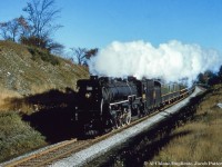 <b>Cityview Drive Part 1 - Westbound:</b> Daily except Sunday train 29 (Toronto - London) swings around the curve approaching Guelph about to cross Cityview Drive.  Located on a blind curve, Cityview was closed in the early 2000s.  U-1-b Mountain 6021, built by CLC in June 1924, would be scrapped in March 1960.<br><br><a href=http://www.railpictures.ca/?attachment_id=46335>Part 2 - Eastbound found here.</a><br><br><i>Original Photographer Unknown, Al Chione Duplicate, Jacob Patterson Collection.</i>