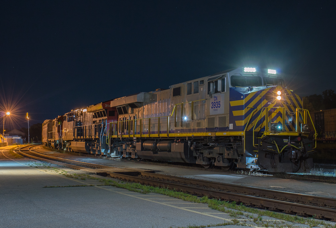CN 434 sits on the North Track at Brantford as the engineer waits on the conductor to make the cut.  Leading 434 on this night was newly acquired CN 3935.  CN 3935 is the ex CREX 1406.  CN has purchased 75 of these ex Citirail lease locomotives to bolster their GE fleet.  Once these are repainted in CN colours I won't pay any attention to them but for now I quite like the patched CN/CREX scheme.