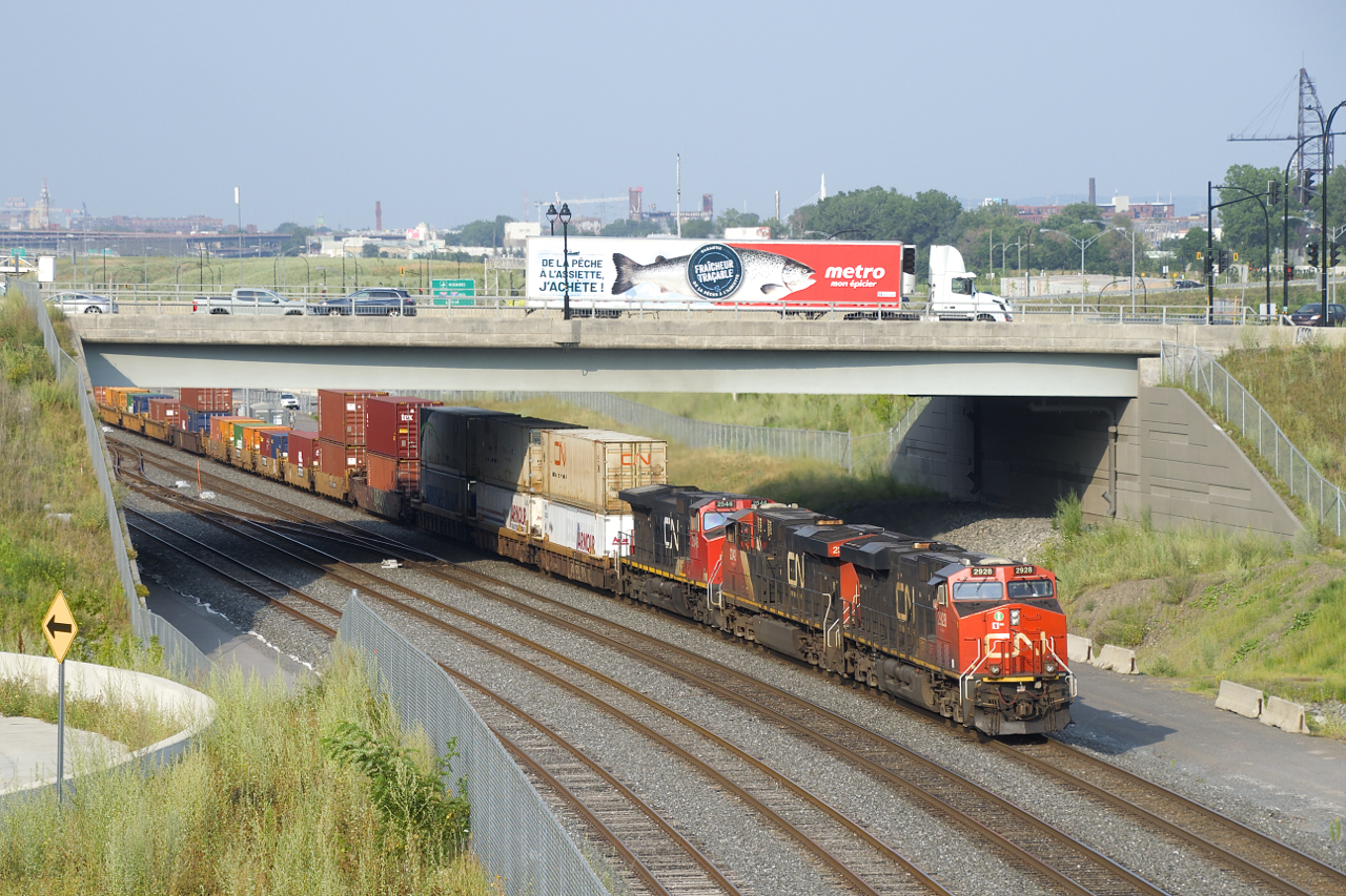 CN 2928, CN 2342 & CN 2546 are the head end power on CN 121 as it passes underneath the Sainte-Anne de Bellevue Boulevard overpass.