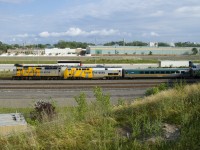 A rare combination of a GMD and a GE wrapped unit (VIA 6416 & VIA 916) lead a slightly late VIA 64 eastwards.