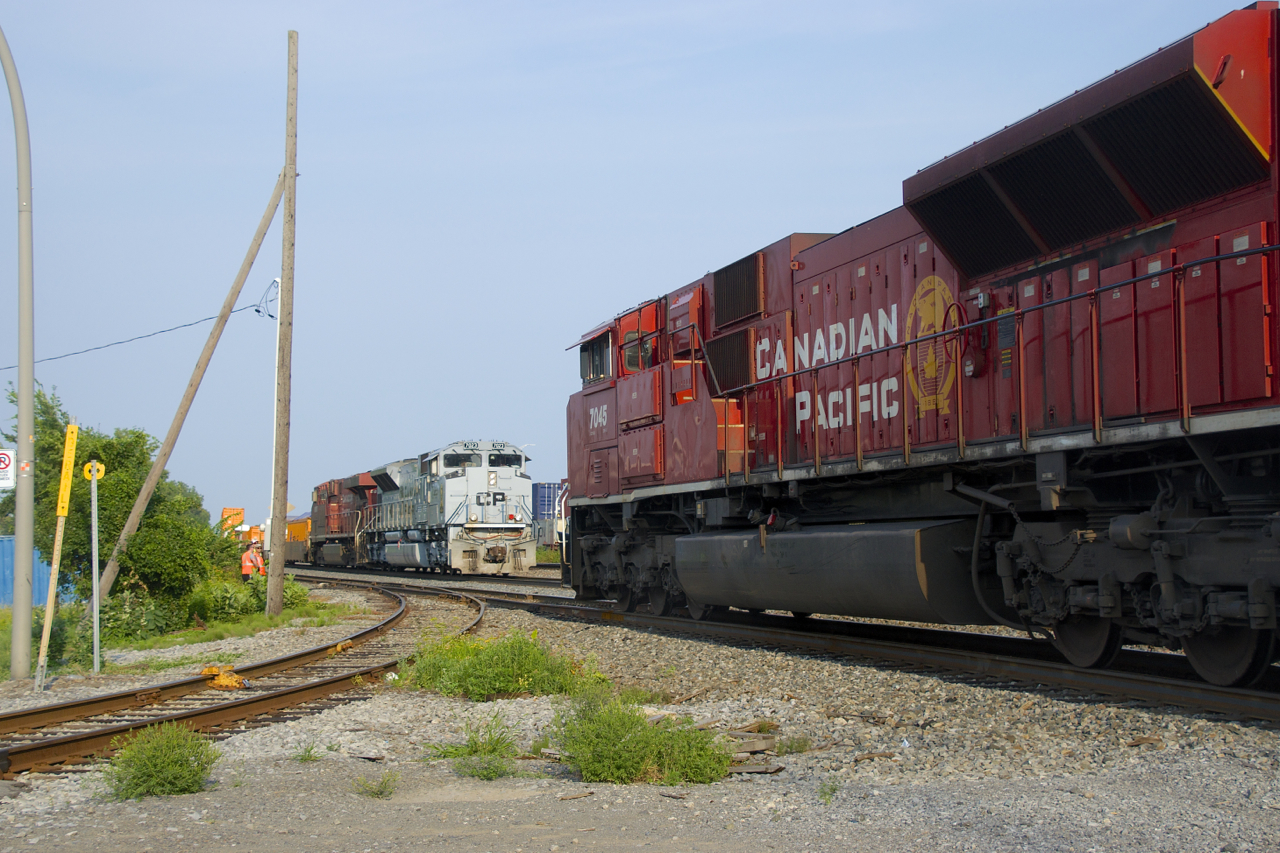 Counterparts and SD70ACU's meet as CP 142 with CP 7045 leading passes CP 143 with Air Force unit CP 7023 leading. The latter is stopped here with engine issues on the leader.