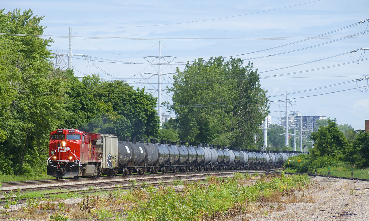 CP 650 is passing the partly removed and quite overgrown Lasalle Yard with a fresh leader.